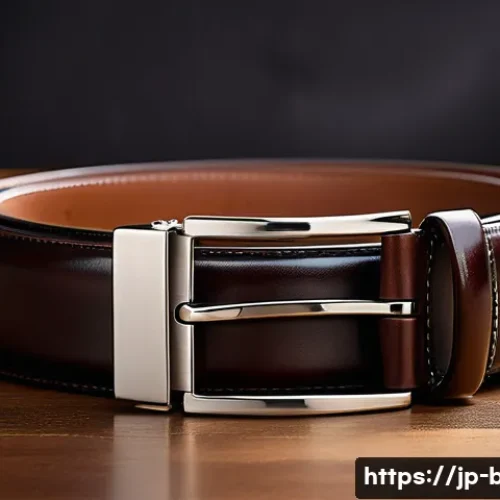 코치의 클래식 레더 벨트와 캔버스 벨트 - A close-up shot of a classic dark brown leather belt with a glossy metal buckle, showcasing the rich...